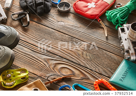 Travel items for hiking over wooden background 37932514