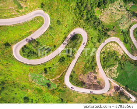 Aerial view of crooked path of road 37933562