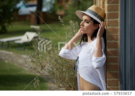 Beautiful woman resting in the summer the Italian garden Beautiful woman resting in the summer the Italian garden 37933657