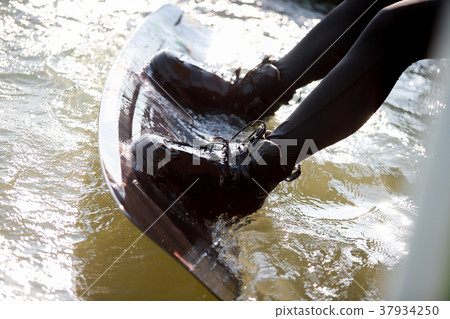 Surfing at the water sports arena. 37934250