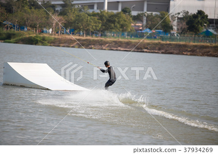 Surfing at the water sports arena. 37934269