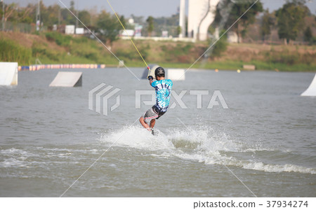 Surfing at the water sports arena. 37934274