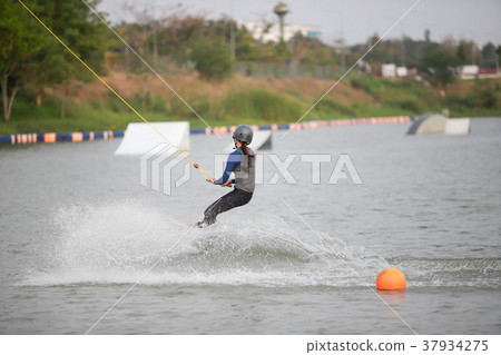 Surfing at the water sports arena. 37934275