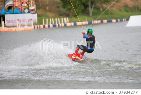 Surfing at the water sports arena. 37934277