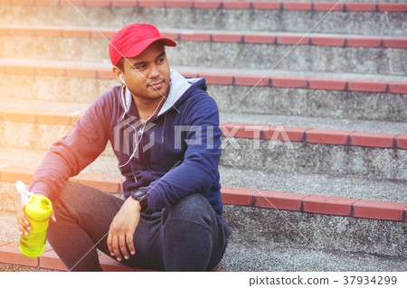 Young man sit break drinking water Young man sit break drinking water 37934299