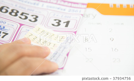 Checking thai lottery on white background. Checking thai lottery on white background. 37934756