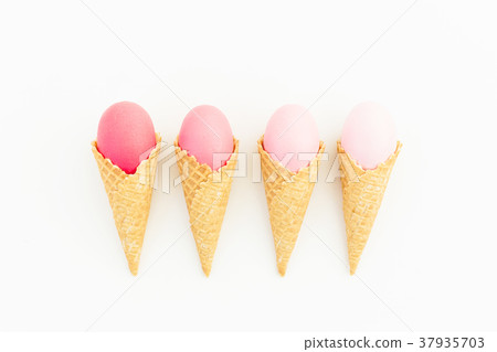 Pink Easter eggs in waffle cone on white Pink Easter eggs in waffle cone on white 37935703