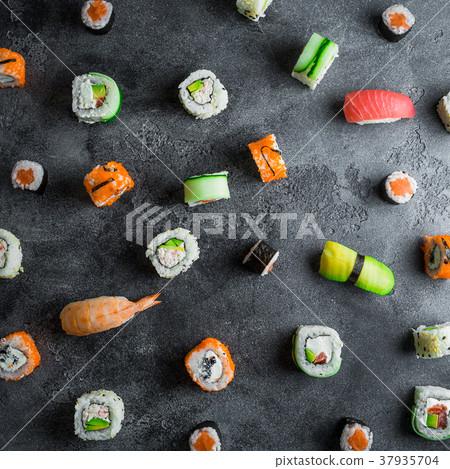 Pattern with sushi rolls on dark background Pattern with sushi rolls on dark background 37935704
