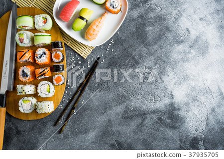 Sushi, rolls, rice with shrimp, sticks and knife Sushi, rolls, rice with shrimp, sticks and knife 37935705