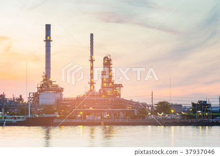Oil factory water side with sunset tone  37937046