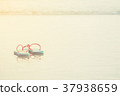 couple blue pink sandal on beach and vintage light 37938659