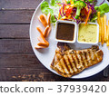 Grilled pork chop steak, French fries and salad  37939420