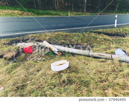 Broken lamp post after car accident.Freeze morning Broken lamp post after car accident.Freeze morning 37940493