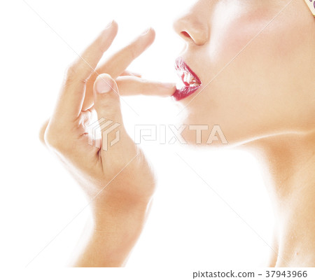 young pretty modern girl with fingers in mouth 37943966