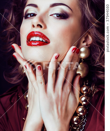 beauty rich brunette woman with a lot of jewellery 37944080