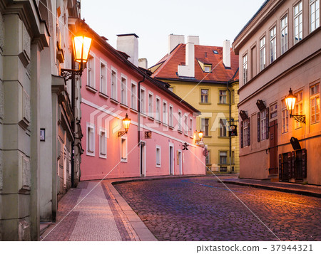 Prague early morning. Cobbled street with lamps Prague early morning. Cobbled street with lamps 37944321