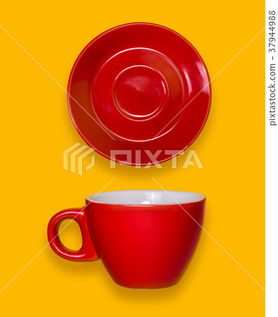 Red cup and a saucer. Coffee set on a yellow background 37944988