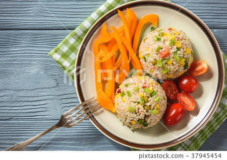 Pearl barley porridge with vegetables. Pearl barley porridge with vegetables. 37945454