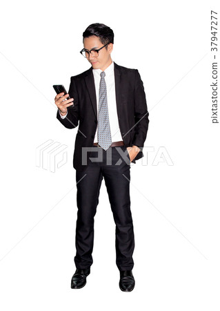 A asian young businessman using smartphone A asian young businessman using smartphone 37947277