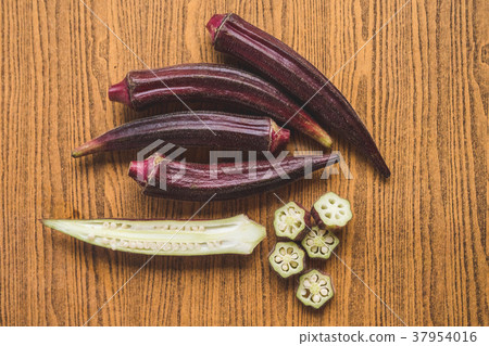 Fresh Red okra on wooden background. Fresh Red okra on wooden background. 37954016