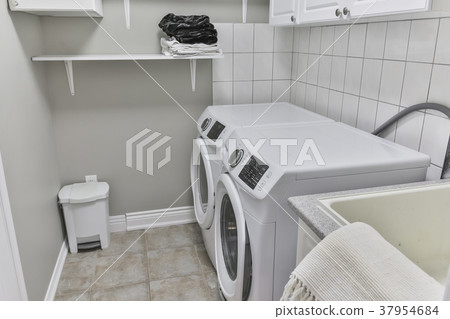 laundry. A washing and dryer machine at home 37954684