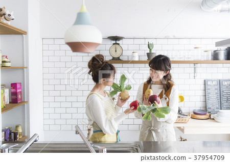 A woman enjoying cooking A woman enjoying cooking 37954709