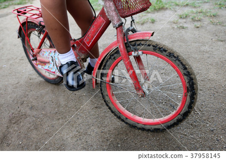 A boy wearing a school uniform with old bicycle A boy wearing a school uniform with old bicycle 37958145