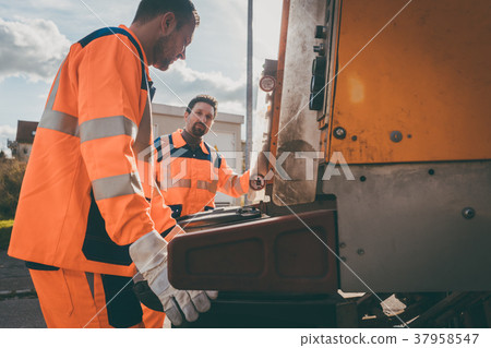 Garbage removal men working for a public utility Garbage removal men working for a public utility 37958547