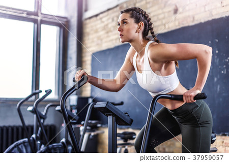Sporty athletic woman in crossfit gym Sporty athletic woman in crossfit gym 37959057