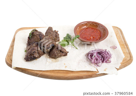Sliced beef steak with tomato sauce. Sliced beef steak with tomato sauce. 37960584