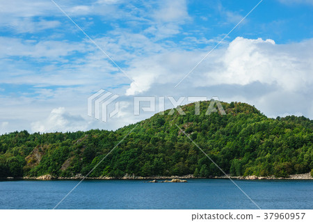 View to the Lyngdalsfjord with mountains in Norway 37960957