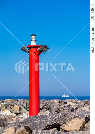 Mole with lighthouse and ship in Kuehlungsborn Mole with lighthouse and ship in Kuehlungsborn 37961008