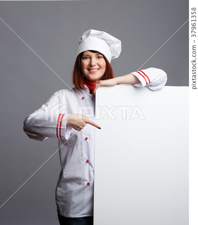 Image of smiling brunette chef in white dressing 37961358