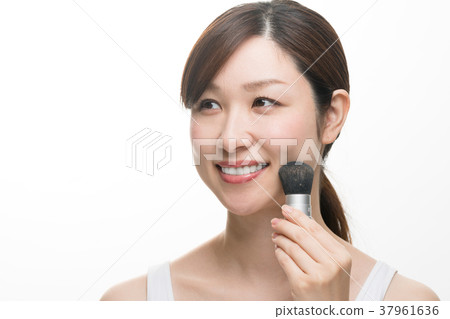 Woman doing makeup, foundation, brush, tank top 37961636
