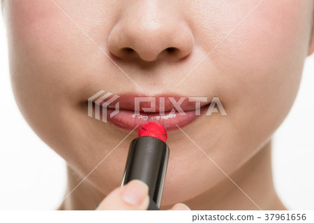 Woman doing makeup, lipstick, lip 37961656