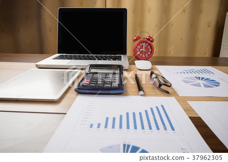 Desk office with laptop,tablet analysis report Desk office with laptop,tablet analysis report 37962305