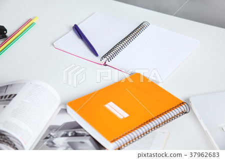 Colorful notebooks and office supplies Colorful notebooks and office supplies 37962683