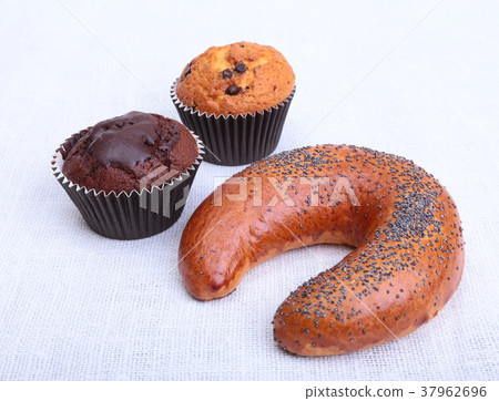 Many mixed breads and muffins on white background 37962696