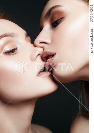sensual kiss of Couple Women with sugar on lips 37964291