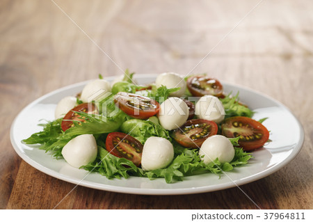 Caprese salad variation with kumato tomatoes and Caprese salad variation with kumato tomatoes and 37964811