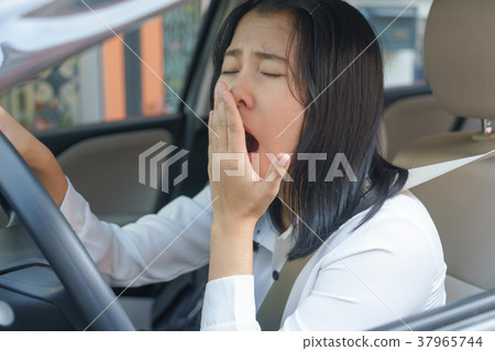 yawn, close eyes young woman driving he yawn, close eyes young woman driving he 37965744