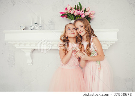 two embracing cute little girls two embracing cute little girls 37968678
