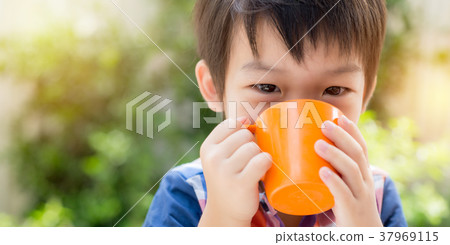 Asian Boy Drinking Milk in the Morning 37969115