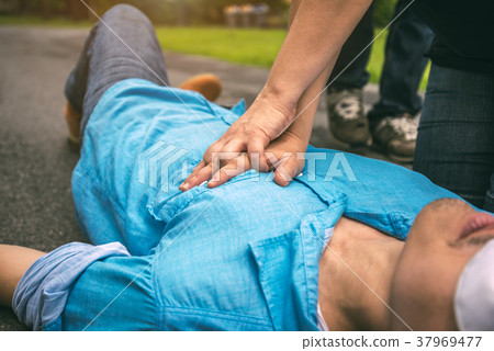 First Aid Emergency CPR on a Man who has Senseless 37969477