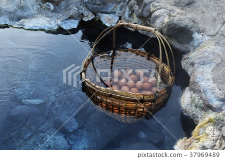 many egg in bamboo basket in hot water  37969489