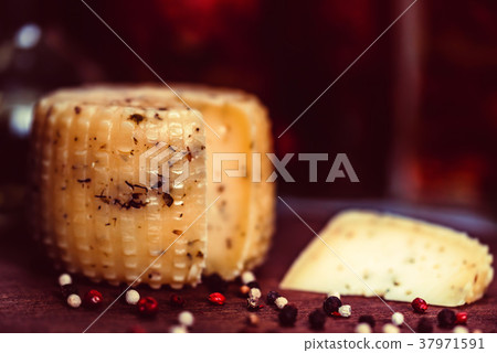 Rustic cheese with herbs and peppercorn Rustic cheese with herbs and peppercorn 37971591