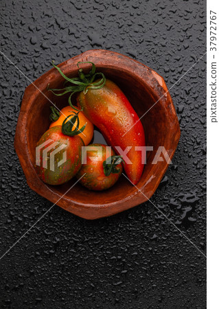 tomatoes and pepper in a bowl tomatoes and pepper in a bowl 37972767
