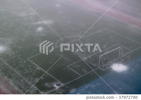 Football goal in the fog in the school stadium Football goal in the fog in the school stadium 37972780