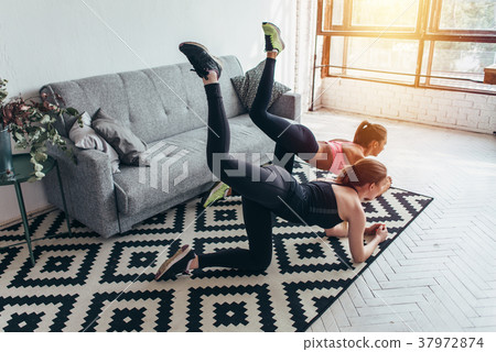 Two sportive female friends doing butt toning 37972874