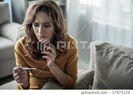 Pregnant woman checking her analysis 37973129